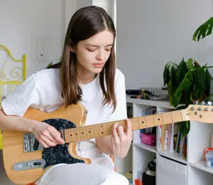 Focused guitar practice showing why quality matters more than quantity