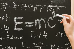 Blackboard with E=mc² and formulas, symbolising how playing music boosts brain power and intelligence.