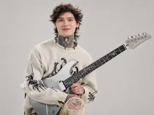 Modern guitar virtuoso performing advanced guitar technique