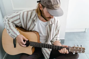 Acoustic guitar strings and fretboard on a steel-string acoustic guitar